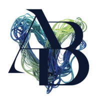 Logo with overlapping navy letters L, A, and B over a background of multicolored tangled lines.