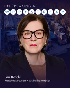 Promotional poster with a professional portrait of a woman wearing tortoise shell glasses against a dark city backdrop, announcing a speaking engagement for Environics Analytics.